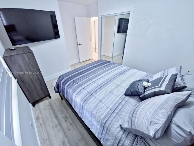 1720 SW 64th Ave, North Lauderdale, FL 33068 - bedroom featuring wood finished floors, a closet, and baseboards