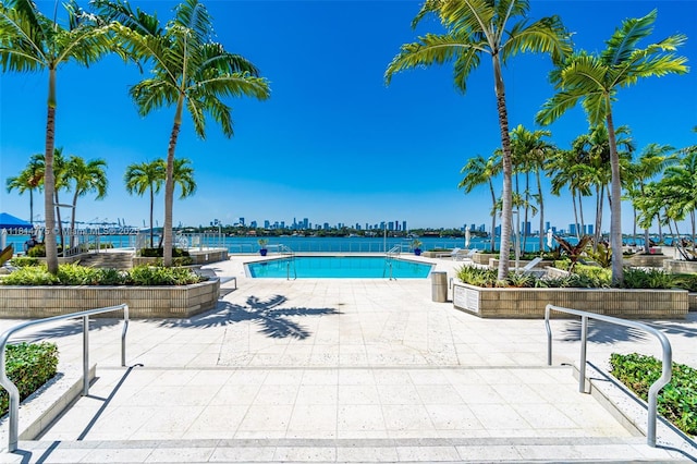800 W Ave Unit 422, Miami Beach, FL 33139 - community pool with a patio area and a skyline view