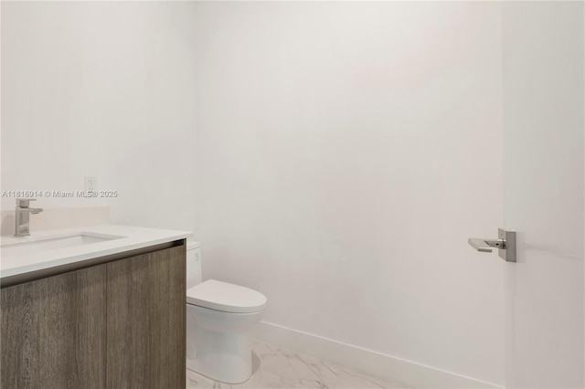 17550 Collins Unit 1604, Sunny Isles Beach, FL 33160 - bathroom featuring vanity, toilet, baseboards, and marble look tile flooring