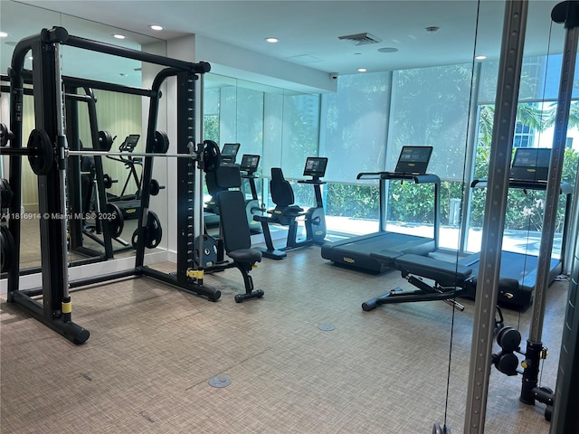 17550 Collins Unit 1604, Sunny Isles Beach, FL 33160 - gym featuring healthy amount of natural light and carpet flooring