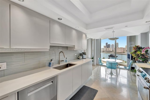 7000 Island Blvd Unit 1701, Aventura, FL 33160 - kitchen featuring a sink, appliances with stainless steel finishes, tasteful backsplash, light countertops, and modern cabinets