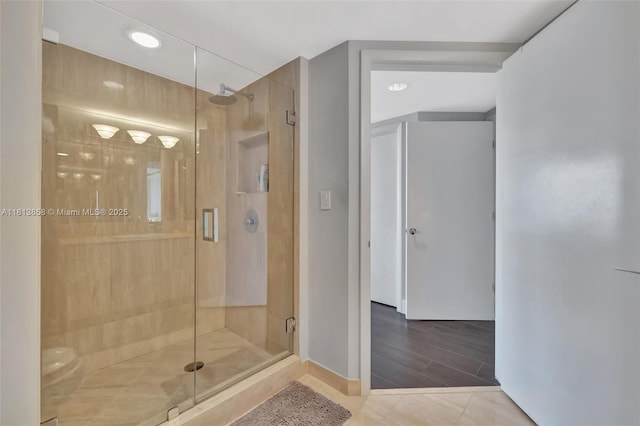 7000 Island Blvd Unit 1701, Aventura, FL 33160 - bathroom featuring a shower stall, baseboards, and tile patterned floors
