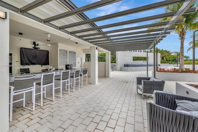 7000 Island Blvd Unit 1701, Aventura, FL 33160 - view of patio / terrace featuring an outdoor bar, a pergola, and a ceiling fan