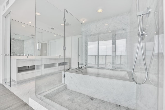 3131 NE 7th Ave Unit 3101, Miami, FL 33137 - full bath featuring a garden tub, a marble finish shower, recessed lighting, and vanity