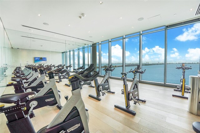 3131 NE 7th Ave Unit 3101, Miami, FL 33137 - workout area with floor to ceiling windows and wood finished floors