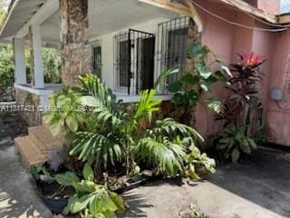 1262 SW 4th St, Miami, FL 33135 - view of side of home with stucco siding