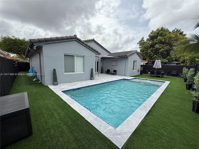6871 SW 159th Pl, Miami, FL 33193 - rear view of house featuring a fenced backyard, a patio area, and stucco siding