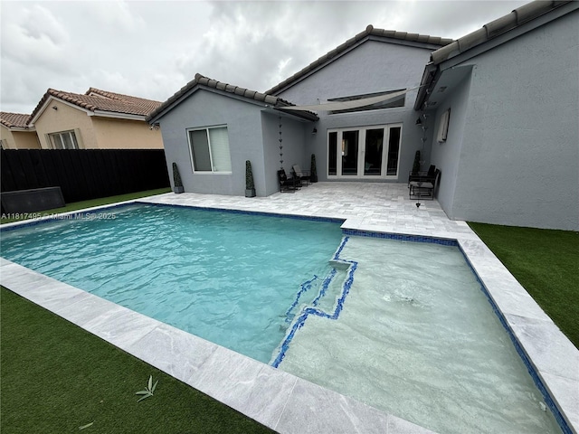 6871 SW 159th Pl, Miami, FL 33193 - view of swimming pool featuring french doors and a patio