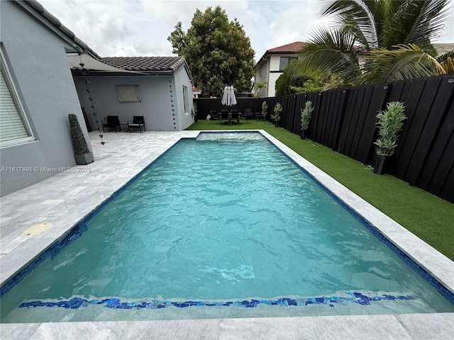 6871 SW 159th Pl, Miami, FL 33193 - view of swimming pool featuring a fenced backyard and a patio area