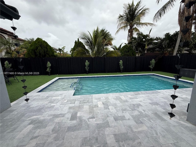 6871 SW 159th Pl, Miami, FL 33193 - view of pool featuring a fenced backyard and a patio