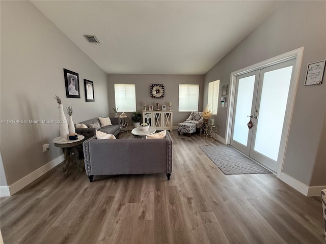 6871 SW 159th Pl, Miami, FL 33193 - living area with vaulted ceiling, wood finished floors, and french doors