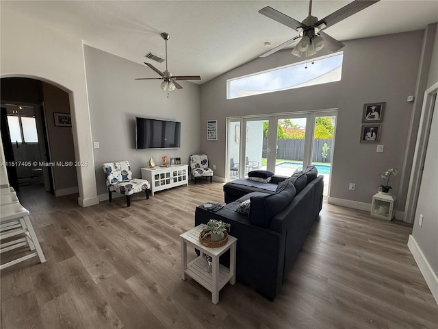 6871 SW 159th Pl, Miami, FL 33193 - living room with a ceiling fan, arched walkways, wood finished floors, and high vaulted ceiling