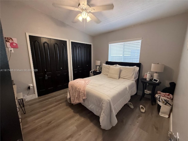 6871 SW 159th Pl, Miami, FL 33193 - bedroom featuring multiple closets, wood finished floors, lofted ceiling, and a ceiling fan