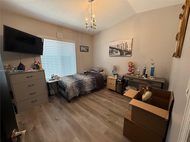 6871 SW 159th Pl, Miami, FL 33193 - bedroom with lofted ceiling, a chandelier, and light wood-style floors