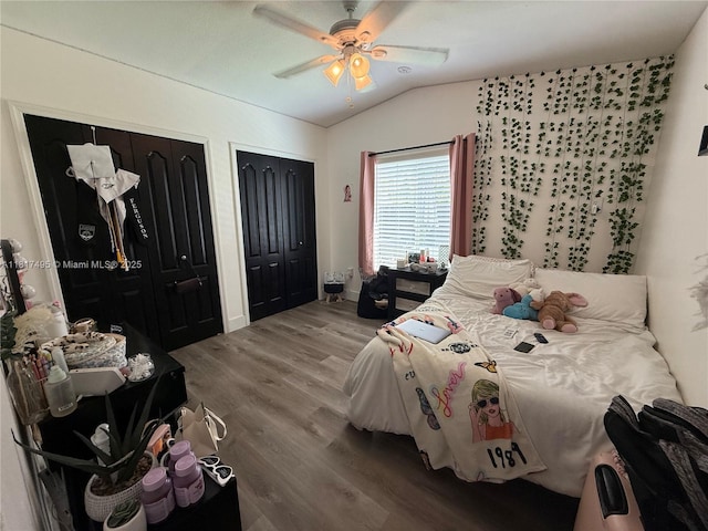 6871 SW 159th Pl, Miami, FL 33193 - bedroom featuring multiple closets, lofted ceiling, wood finished floors, and ceiling fan