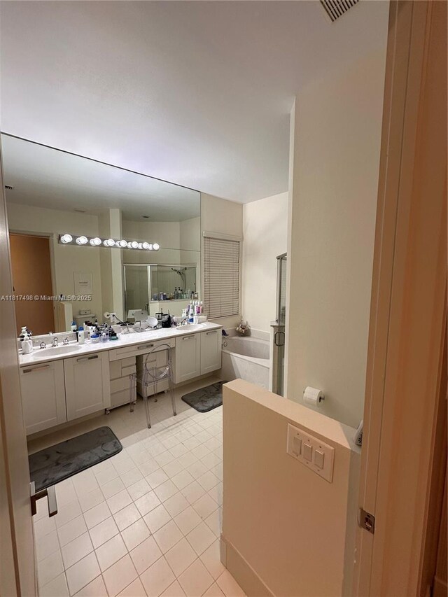 2046 NE 4th Ct, Homestead, FL 33033 - full bathroom with double vanity, a garden tub, a shower stall, and tile patterned floors
