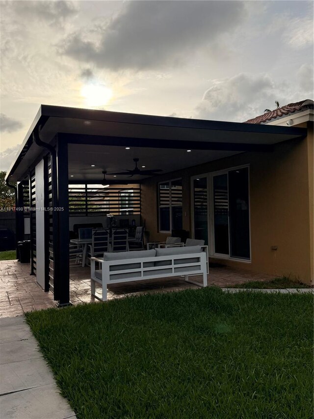 2046 NE 4th Ct, Homestead, FL 33033 - rear view of house with an outdoor hangout area, a ceiling fan, a patio area, and a lawn