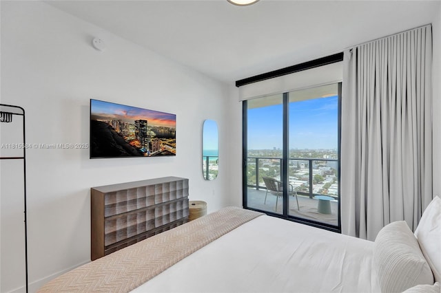 580 72nd St Unit 1712, Miami, FL 33141 - bedroom with access to outside and expansive windows