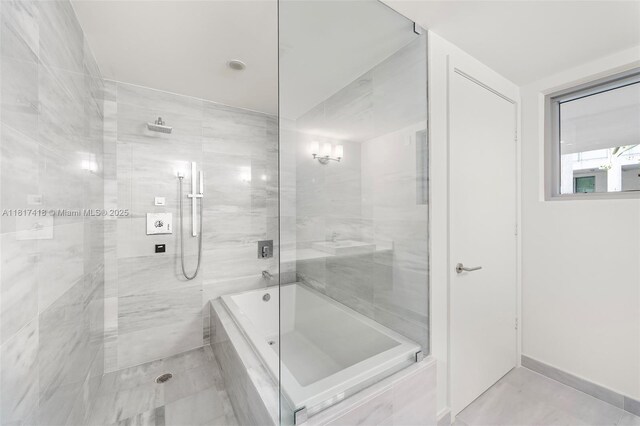 1201 20th St Unit 310, Miami Beach, FL 33139 - full bathroom featuring tiled shower and a tub to relax in