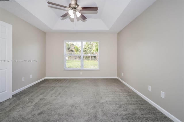 138 SW Bedford Rd, Port St Lucie, FL 34953 - empty room featuring a raised ceiling, ceiling fan, carpet, and baseboards