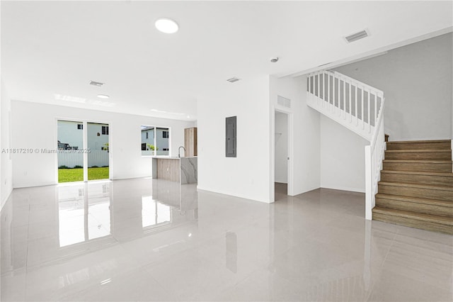 22481 SW 125th Ave Unit A, Miami, FL 33170 - empty room with stairway, electric panel, light tile patterned flooring, and recessed lighting