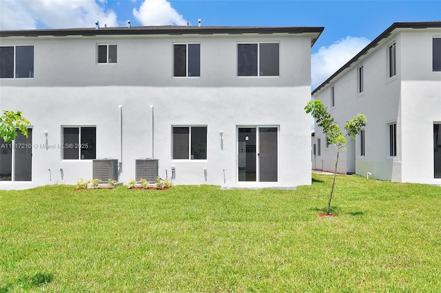 22481 SW 125th Ave Unit A, Miami, FL 33170 - back of property featuring a lawn, stucco siding, and cooling unit