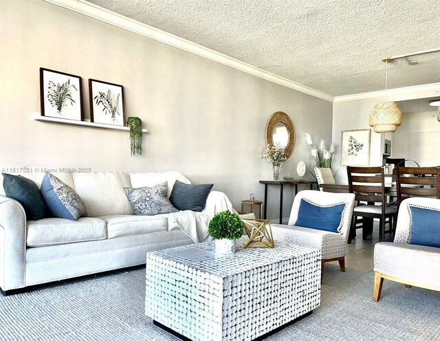 5601 Collins Ave Unit 923, Miami Beach, FL 33140 - carpeted living room featuring ornamental molding and a textured ceiling