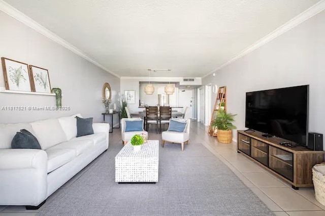 5601 Collins Ave Unit 923, Miami Beach, FL 33140 - living room featuring ornamental molding and light tile patterned floors