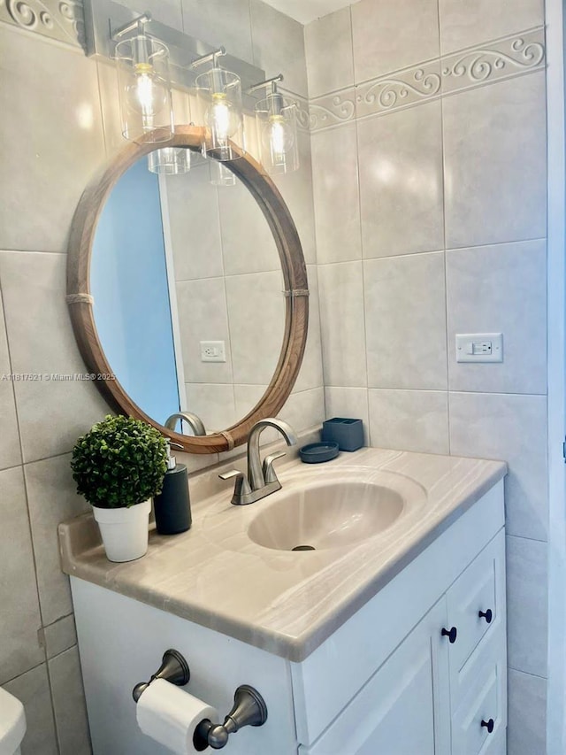5601 Collins Ave Unit 923, Miami Beach, FL 33140 - half bath featuring tile walls and vanity