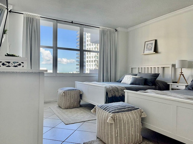 5601 Collins Ave Unit 923, Miami Beach, FL 33140 - bedroom with ornamental molding, tile patterned floors, and a textured ceiling