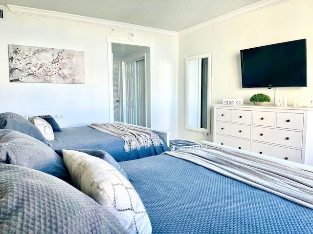 5601 Collins Ave Unit 923, Miami Beach, FL 33140 - bedroom featuring crown molding and a textured ceiling