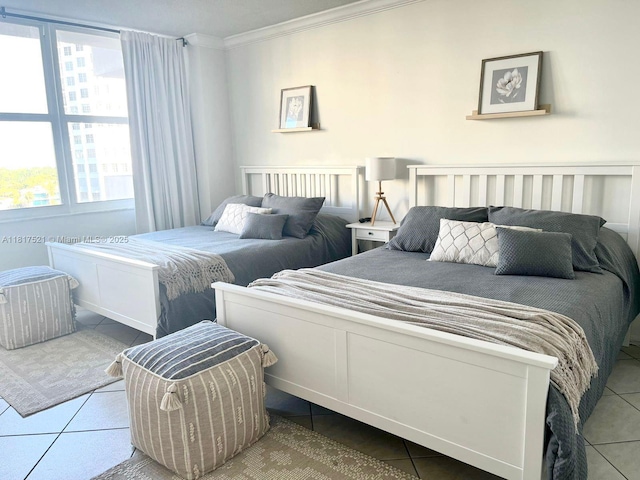 5601 Collins Ave Unit 923, Miami Beach, FL 33140 - bedroom featuring crown molding and tile patterned flooring