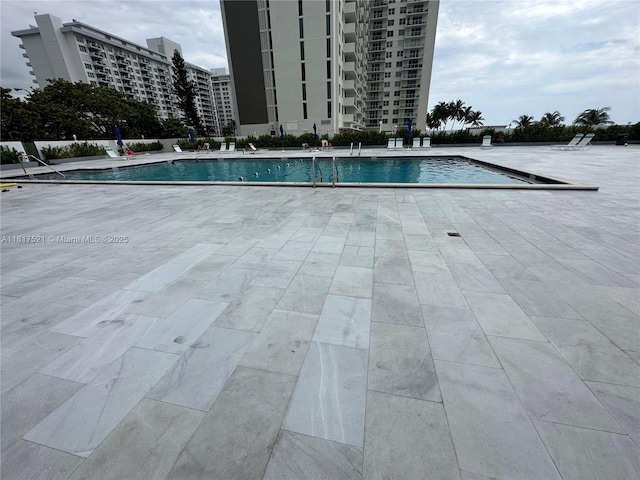 5601 Collins Ave Unit 923, Miami Beach, FL 33140 - community pool featuring a patio area