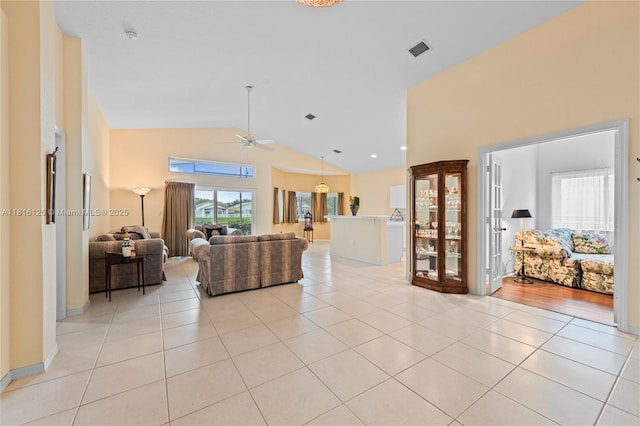 5402 NW 110th Ave, Doral, FL 33178 - living room with a ceiling fan, light tile patterned floors, and high vaulted ceiling