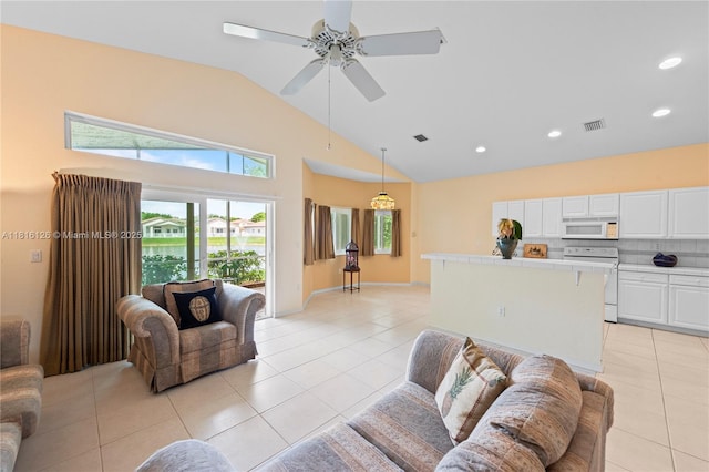 5402 NW 110th Ave, Doral, FL 33178 - living area with light tile patterned floors, high vaulted ceiling, a ceiling fan, and recessed lighting