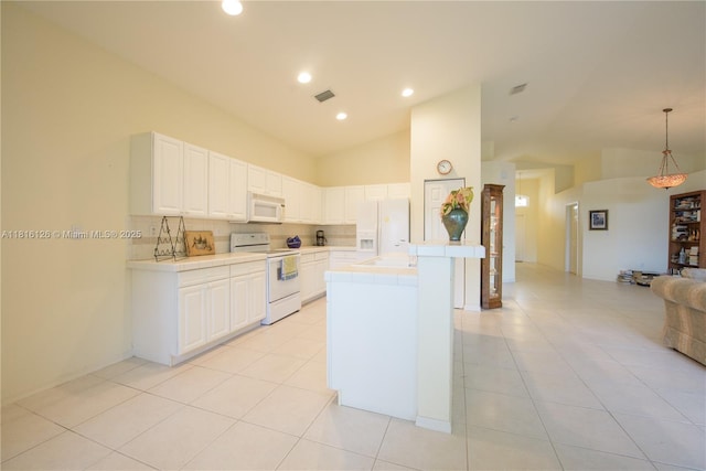 5402 NW 110th Ave, Doral, FL 33178 - kitchen featuring white appliances, tile countertops, tasteful backsplash, white cabinetry, and light tile patterned flooring