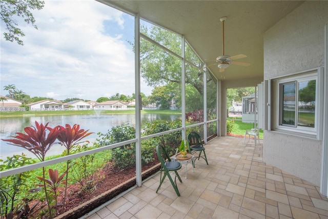 5402 NW 110th Ave, Doral, FL 33178 - unfurnished sunroom with a water view and a ceiling fan
