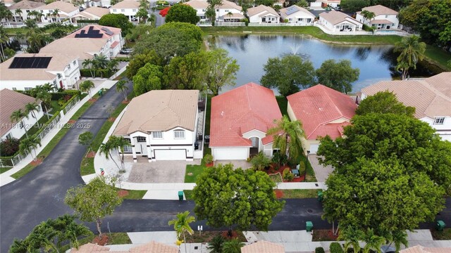 5402 NW 110th Ave, Doral, FL 33178 - aerial perspective of suburban area with a large body of water