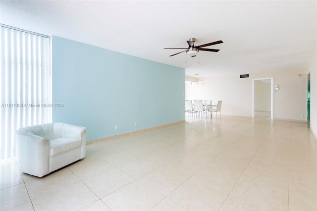 1360 S Ocean Blvd Unit 304, Pompano Beach, FL 33062 - unfurnished room with ceiling fan, light tile patterned floors, and a textured ceiling