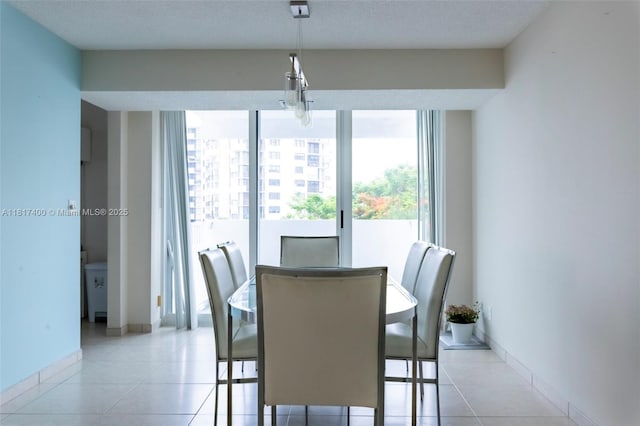 1360 S Ocean Blvd Unit 304, Pompano Beach, FL 33062 - dining space featuring light tile patterned floors and baseboards