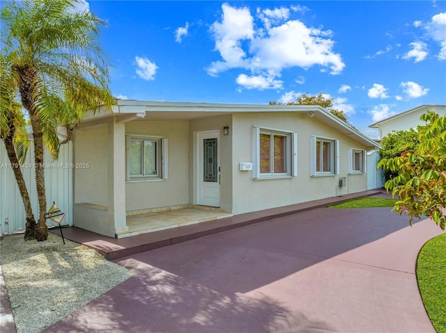 11020 SW 55th St, Miami, FL 33165 - view of front of house featuring stucco siding and a patio area