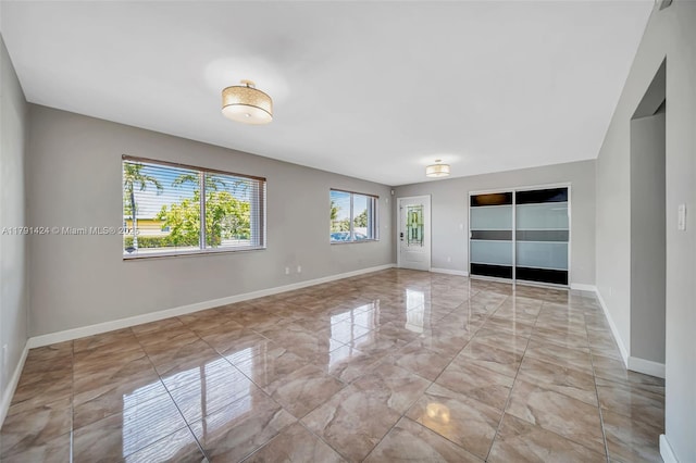 11020 SW 55th St, Miami, FL 33165 - spare room with marble finish flooring and baseboards