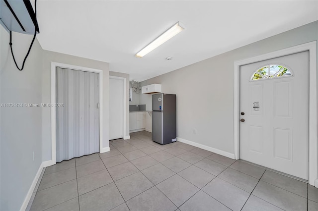 11020 SW 55th St, Miami, FL 33165 - entryway with baseboards and light tile patterned floors