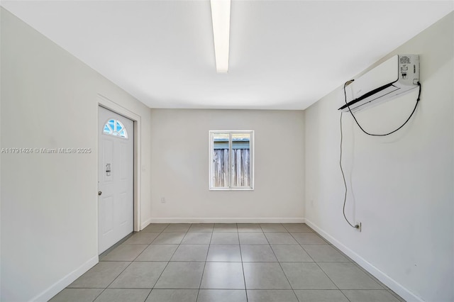 11020 SW 55th St, Miami, FL 33165 - foyer entrance with baseboards, a wall mounted AC, and light tile patterned floors