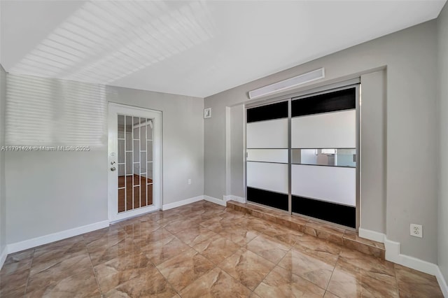11020 SW 55th St, Miami, FL 33165 - spare room with marble finish flooring and baseboards