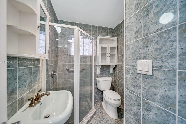 11020 SW 55th St, Miami, FL 33165 - bathroom with tile walls, a shower stall, toilet, and a sink
