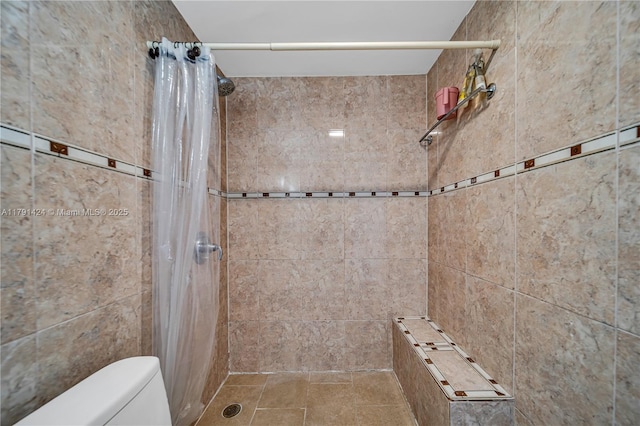 11020 SW 55th St, Miami, FL 33165 - full bathroom with a tile shower, toilet, and tile walls