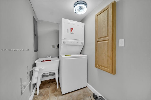 11020 SW 55th St, Miami, FL 33165 - laundry room with stacked washing machine and dryer and baseboards