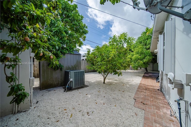 11020 SW 55th St, Miami, FL 33165 - fenced backyard featuring cooling unit and a patio area