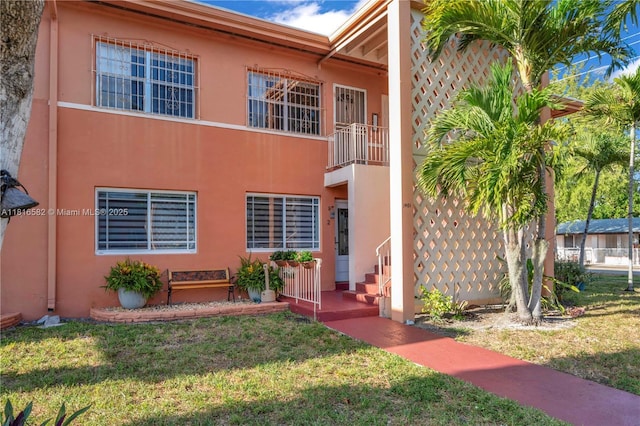3401 SW 10th St Unit 2B, Miami, FL 33135 - view of front of property featuring a front lawn and stucco siding